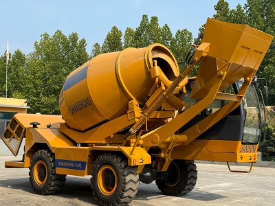 Self-loading concrete mixer