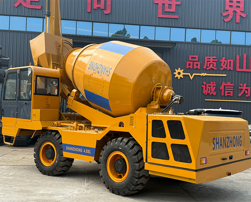 Self loading concrete mixer